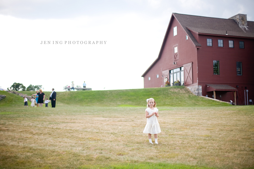 The Barn at Gibbet Hill wedding photography - flower girl in front of barn