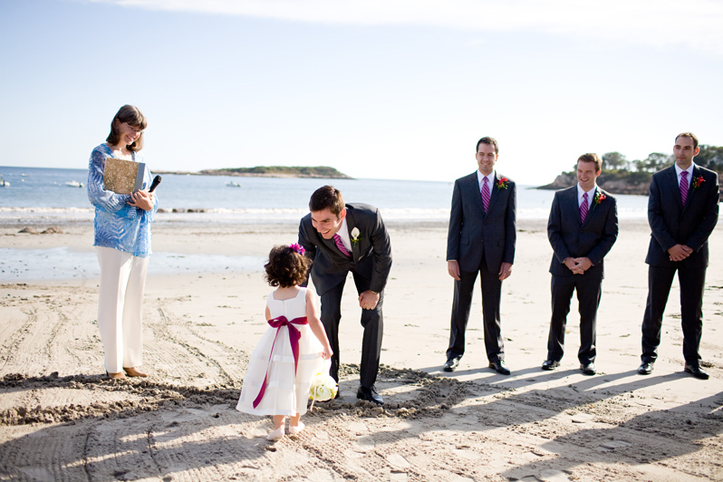 Beach wedding in Manchester, MA - groom greets flower girl